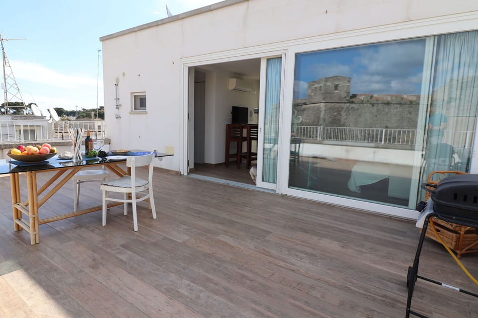 Flooring, Floor, Wood Flooring, Apartment, Hardwood, Deck, Wood Stain, Plank, Balcony, Chair