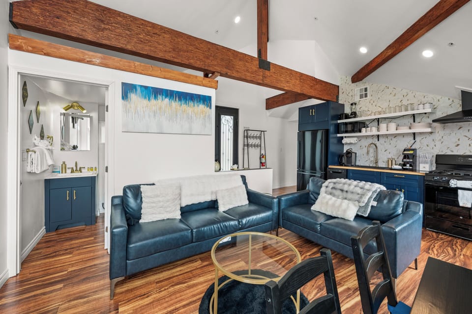 Living Room - Living Room with lake views, comfy seating area, smart TV and vaulted ceilings.