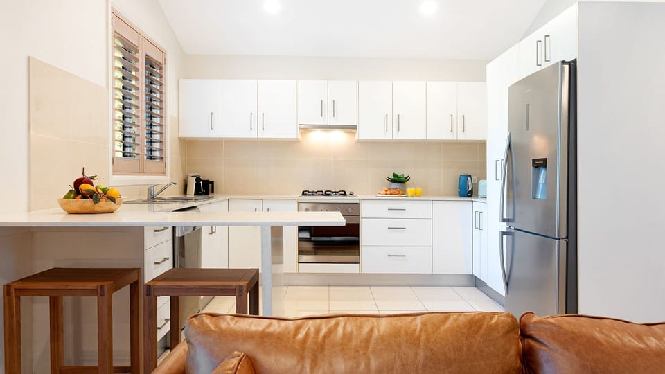 Kiama Central Townhouse | Kitchen (upstairs) | Coffee pod machine | Dishwasher | Refrigerator | Oven with gas stove top | Breakfast bar | Wi-Fi