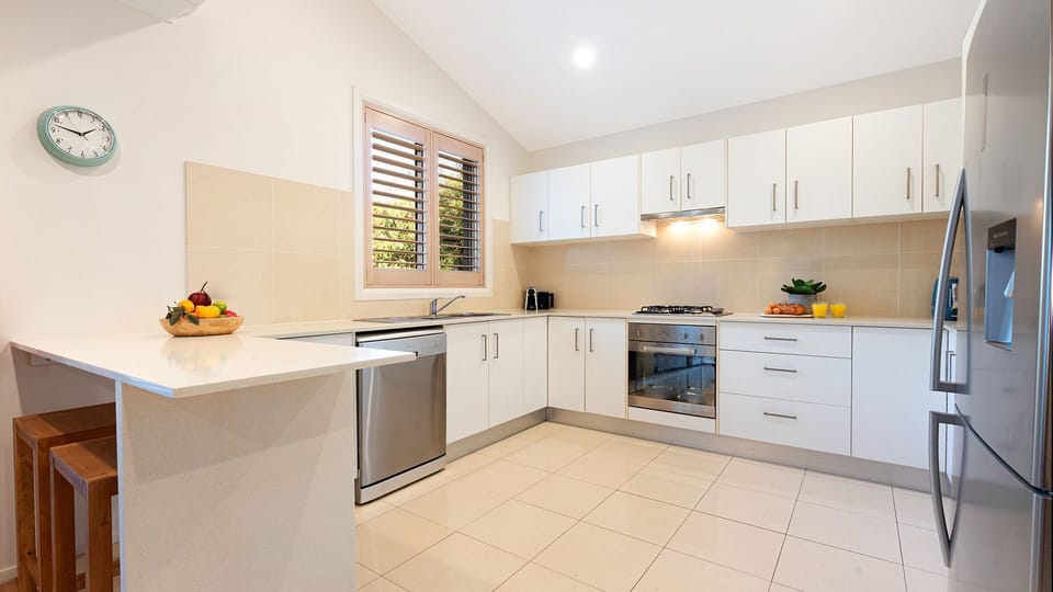 Kiama Central Townhouse | Kitchen (upstairs) | Coffee pod machine | Dishwasher | Refrigerator | Oven with gas stove top | Breakfast bar | Wi-Fi