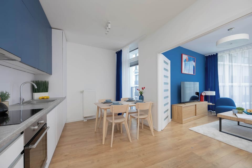 An open-plan interior connecting the kitchen, dining area, and living room. The bright layout makes everyday living both practical and inviting.