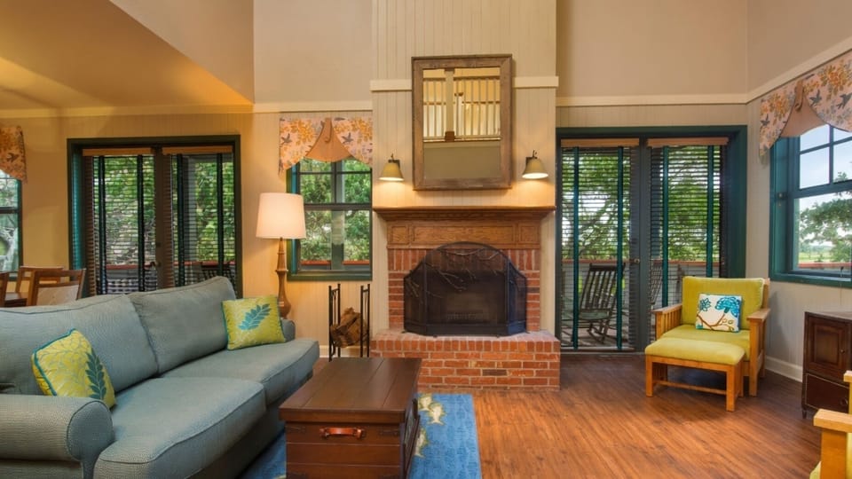 Living Area • Fireplace + Balcony Access