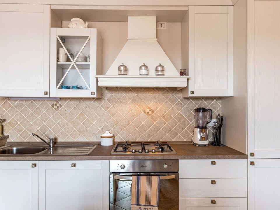 Kitchen, Wood, Interior Design, Cabinetry, Flooring, Countertop, Kitchen Stove, Kitchen Appliance, Light Fixture, Ceiling