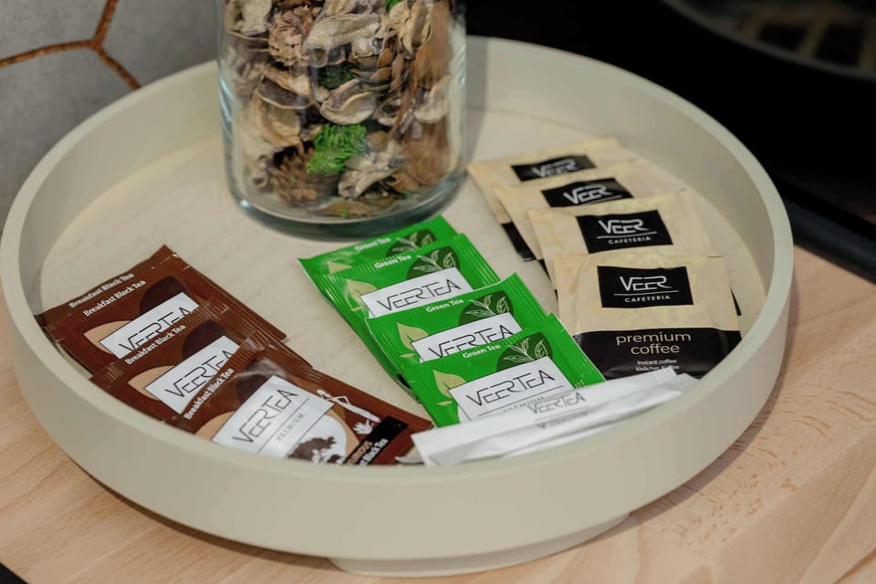 A round serving tray is carefully arranged on the counter to offer a welcoming gesture for guests upon their arrival.