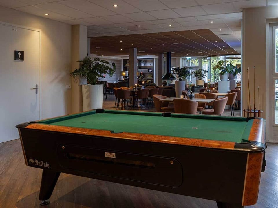 Challenge friends to a lively game night by the bar.