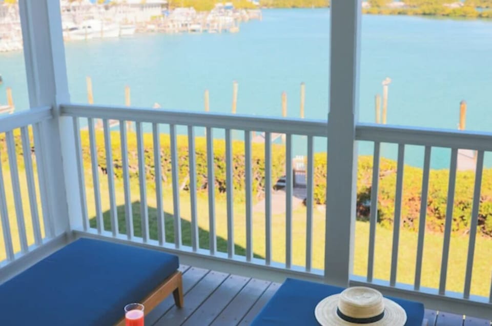 Sip morning coffee while overlooking calm blue water.