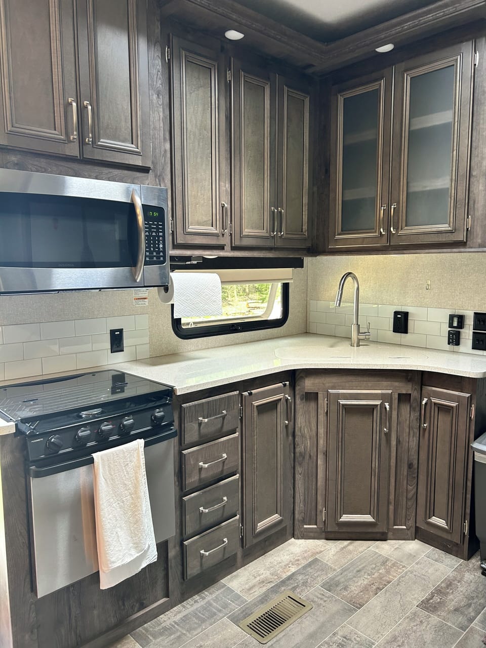 large kitchen with tons of storage. Cookware, plates and silverware provided.