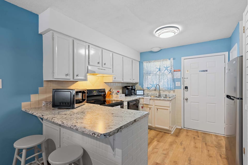 Counter seating provides a convenient spot for breakfast, coffee, or a quick snack.