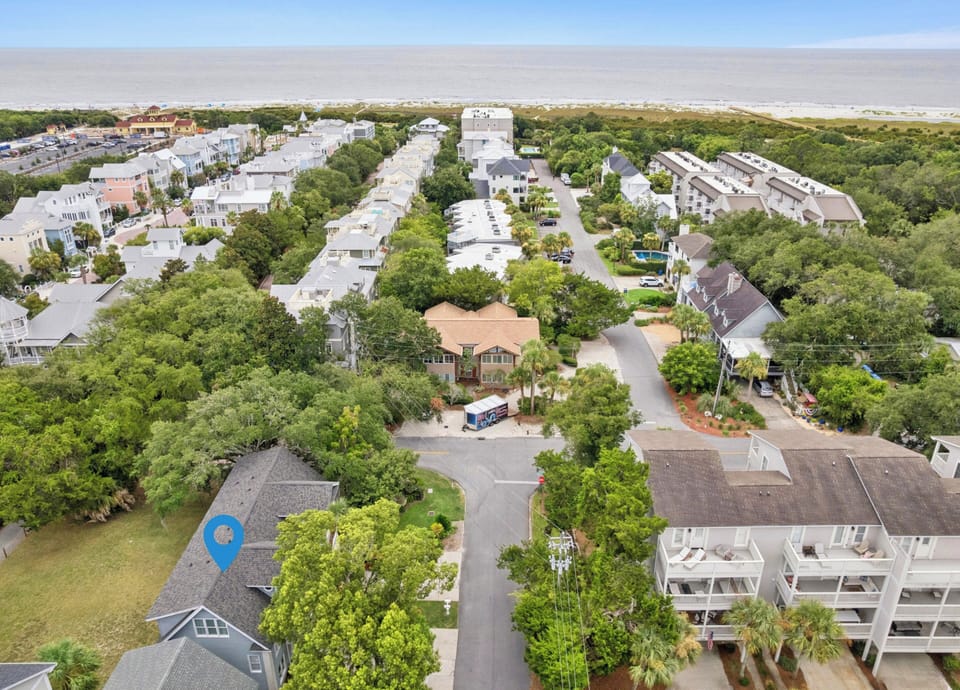 Coastal neighborhood with lush landscaping and nearby beach access, offering a tranquil retreat surrounded by natural beauty.