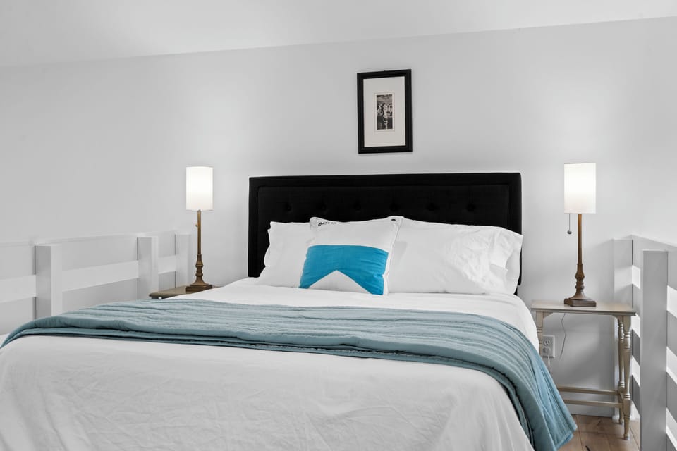 Bright, cozy bedroom with plush linens and stylish modern touches