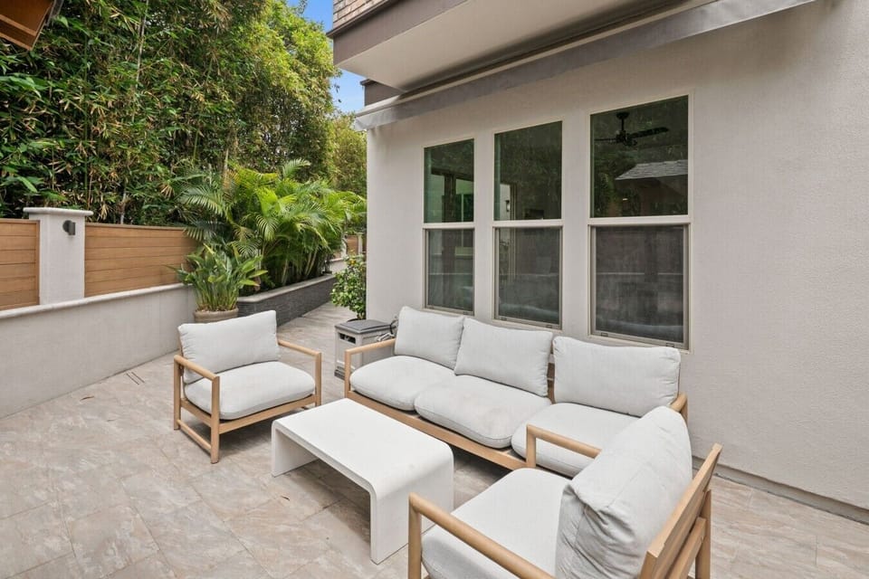 Outdoor living room with an automated shade cover