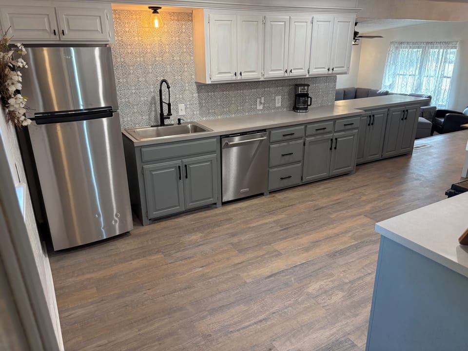 Fully equipped kitchen with stainless steel appliances and plenty of space.