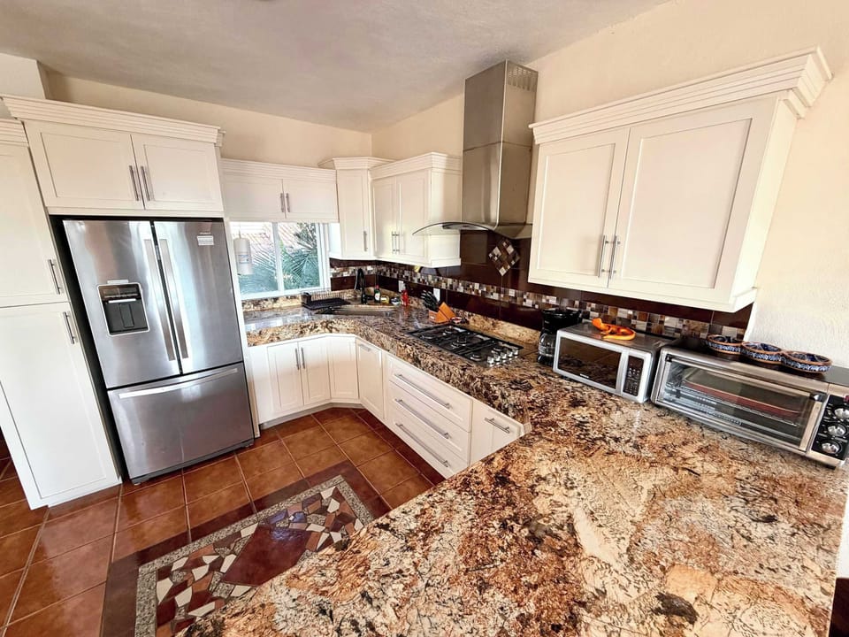 Main house full kitchen with granite details.
