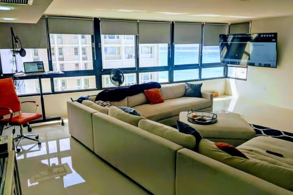 Ocean Views and Breeze from the Living room and adjustable standing/sitting desk