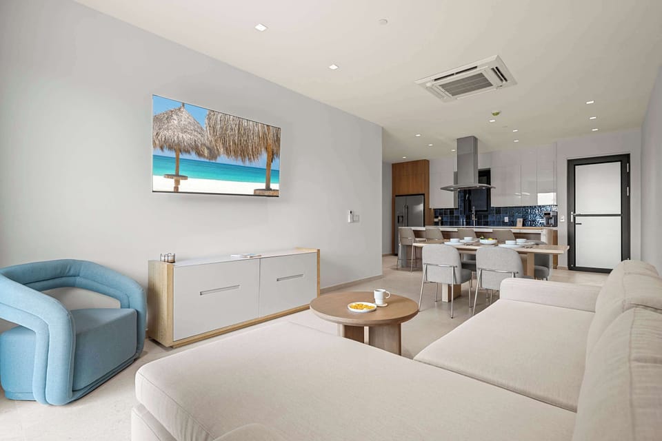 Soft blue accents give the living space a fresh coastal feel