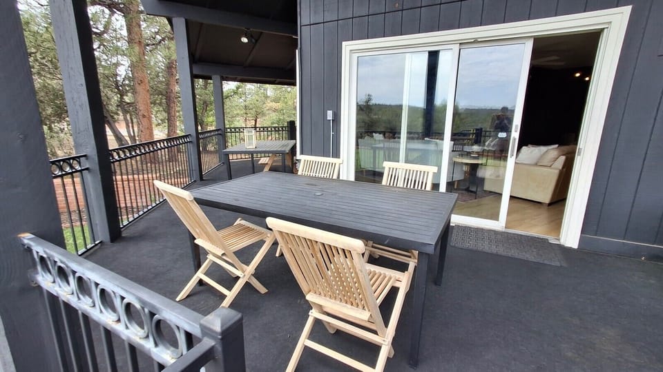 Lovely deck area with outdoor dining and cozy seating, just off the main level`s living room space