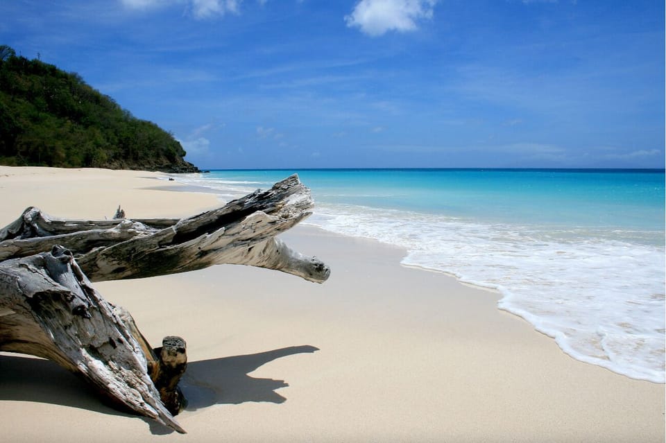 Wander pristine white sands and listen to gentle waves roll.