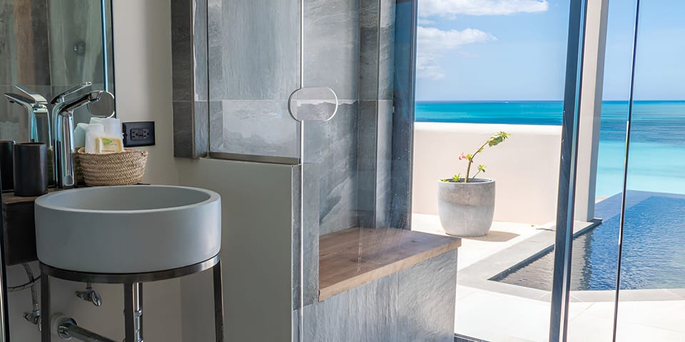 Refresh at the spa-style vanity with a stunning ocean backdrop.