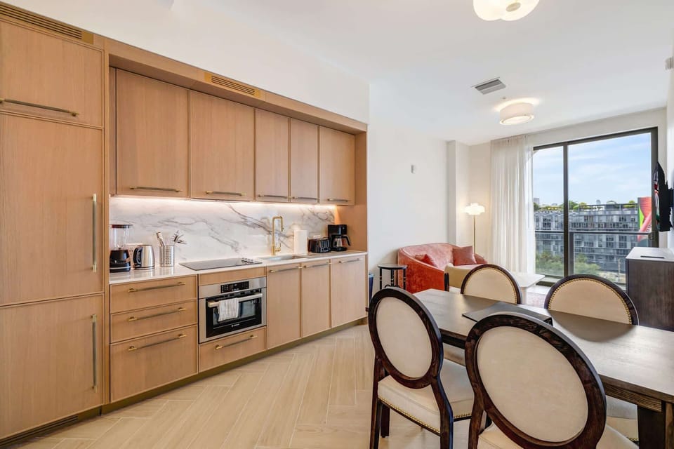 Stylish studio with a modern kitchen, cozy seating, and stunning city views. Perfect for a comfortable stay.