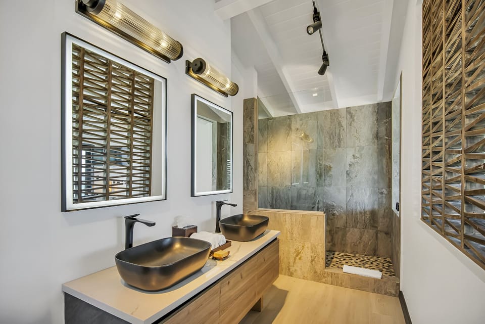 Refresh in a spa-like bath with dual sinks and rain shower.