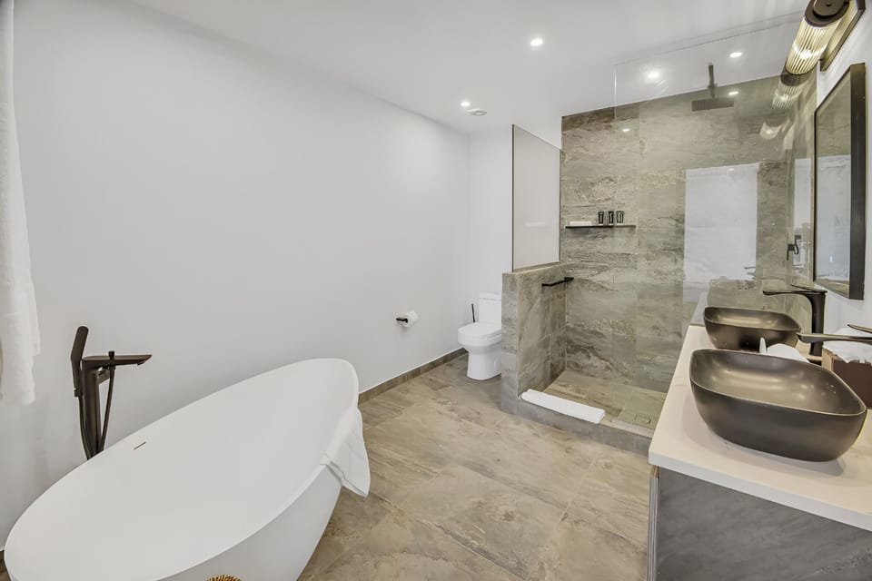 Soak peacefully in a deep tub after sun-filled beach days.