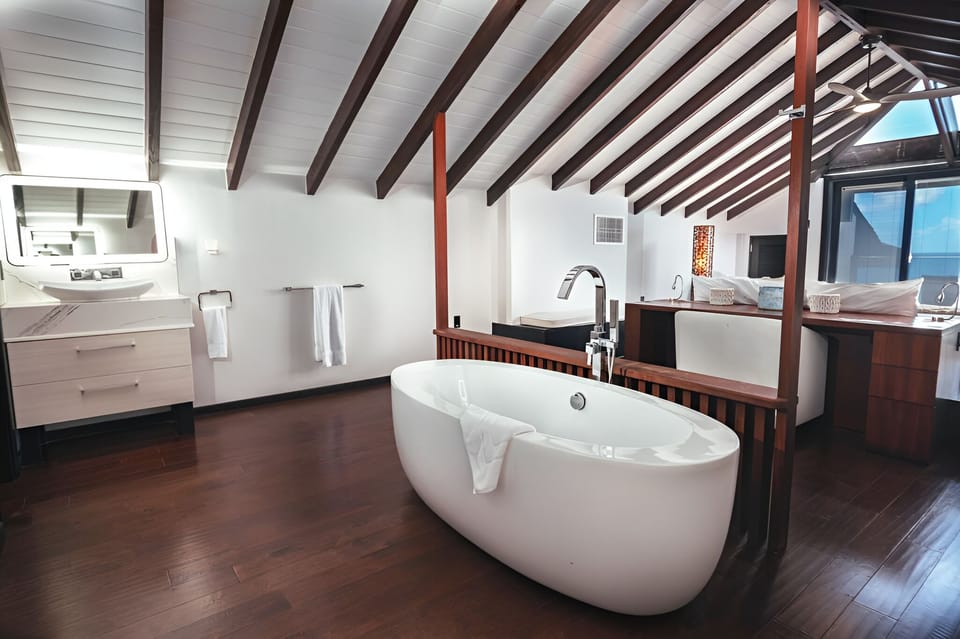 Soak slowly in the freestanding tub beneath soaring ceilings.