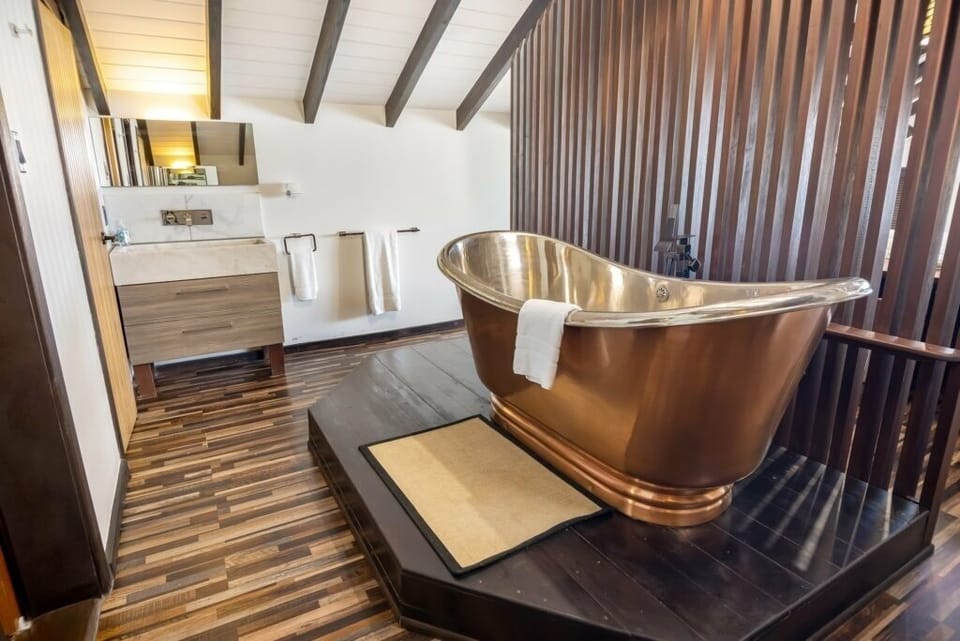 Indulge in a spa-like soak in the elegant freestanding tub.