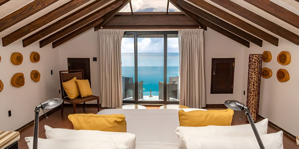 Dine alfresco beside the infinity edge with endless sea views.