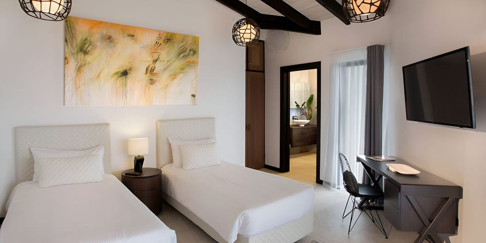 Settle into twin beds perfect for friends or family stays.