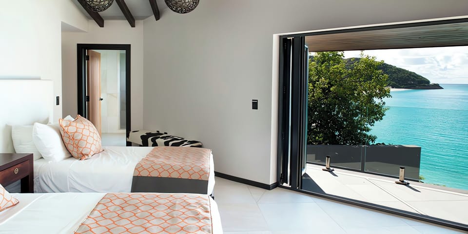 Drift off with sea breezes and sunrise views outside.