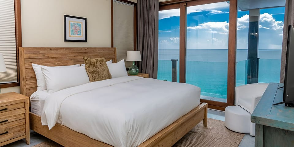 Wake up to endless ocean blues from crisp linens.