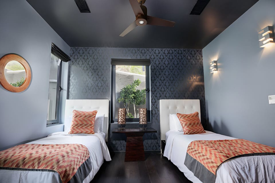 Recharge in a cozy twin room with stylish, calming design.