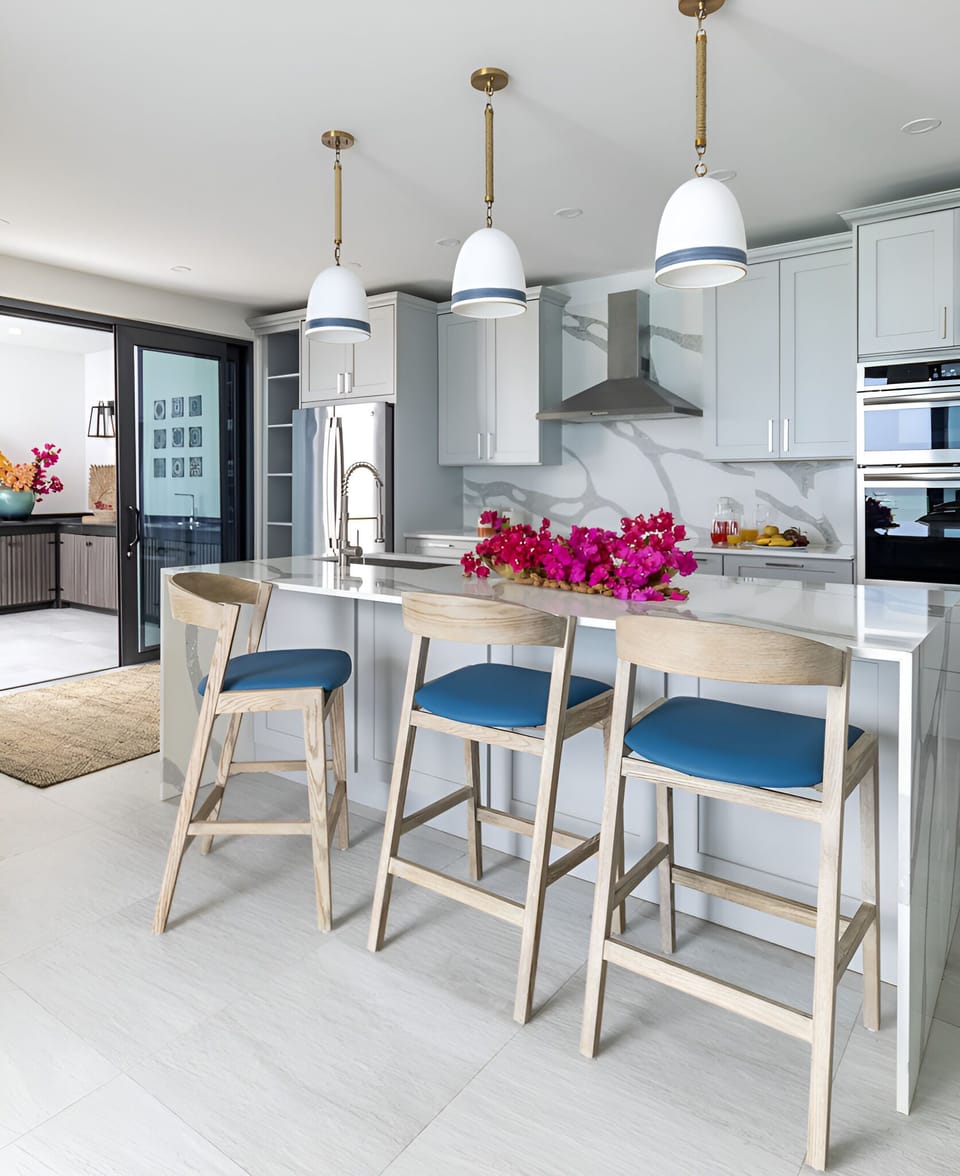 Gather at the marble island for easy, elegant meals.