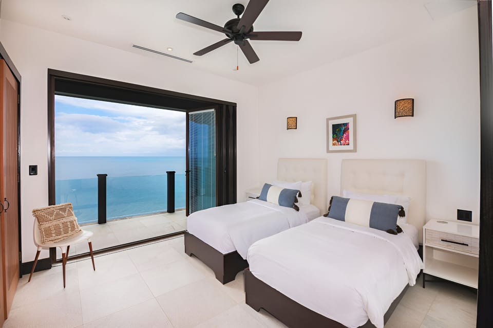 Stretch out in bright twin beds with calming horizon views.