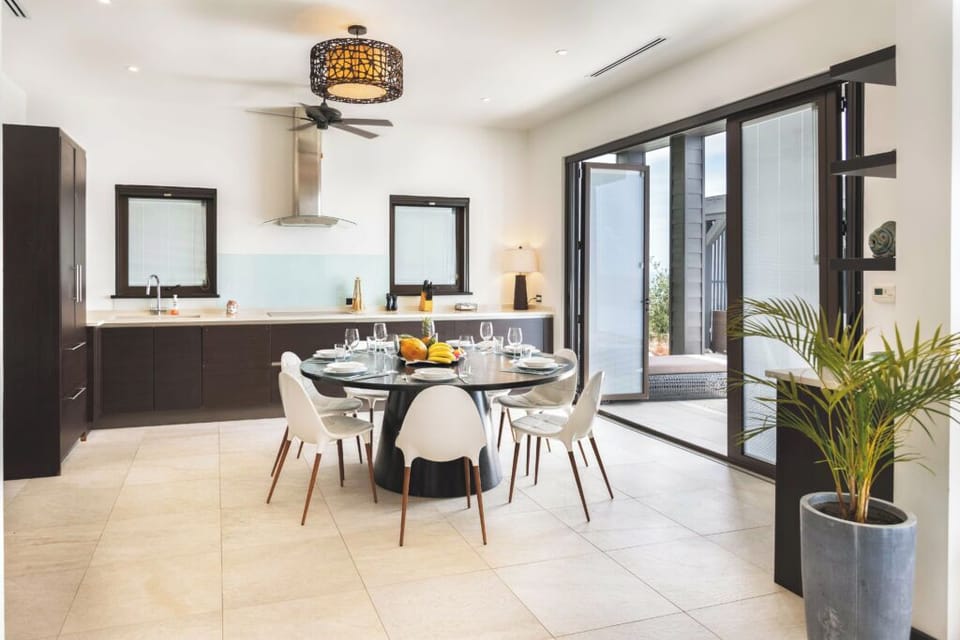 Cook and linger in a sunlit kitchen beside open doors.