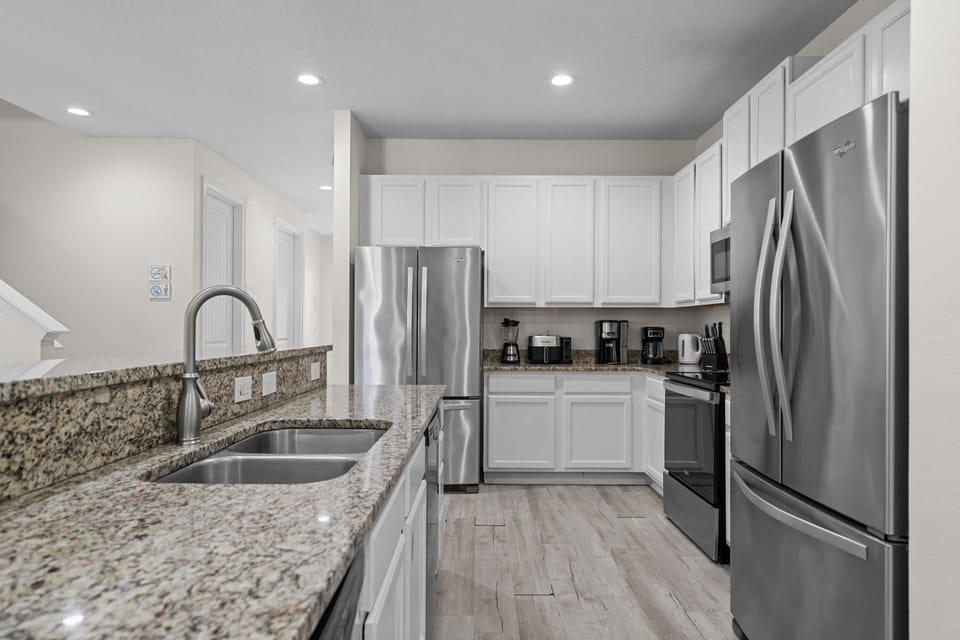 Fully equipped kitchen with generous counter space for preparing meals during your stay.