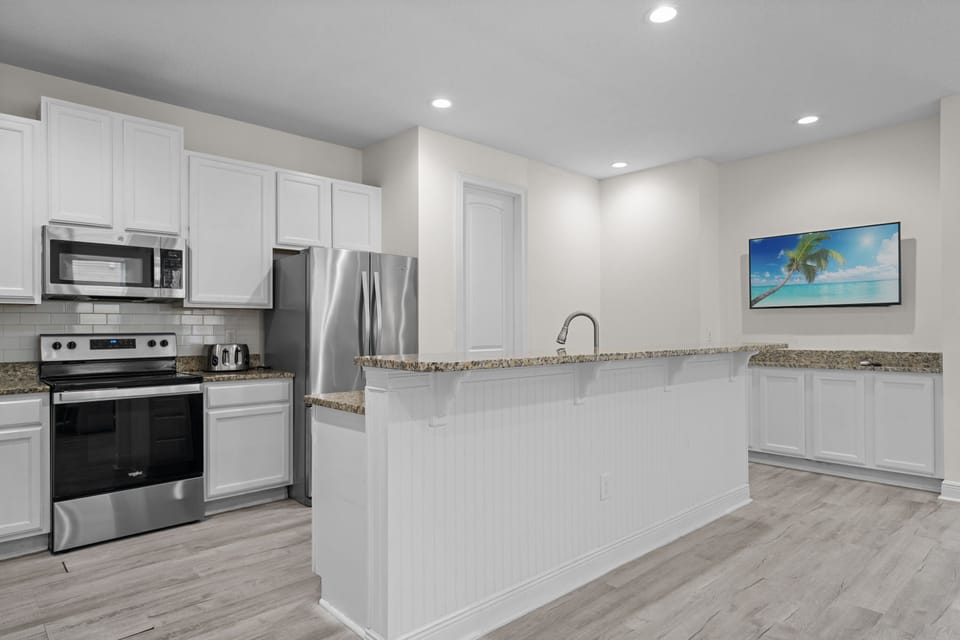 Fully equipped kitchen with generous counter space for preparing meals during your stay.
