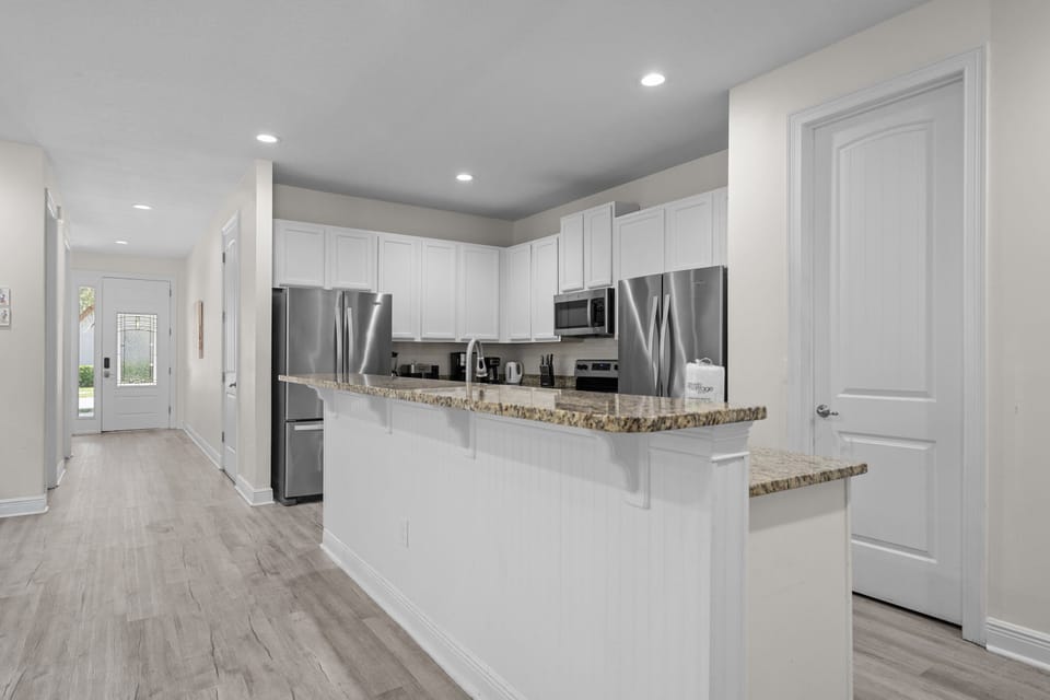 Fully equipped kitchen with generous counter space for preparing meals during your stay.