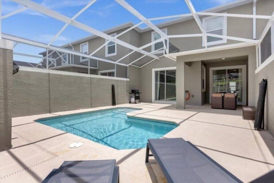 Private screened pool with patio seating