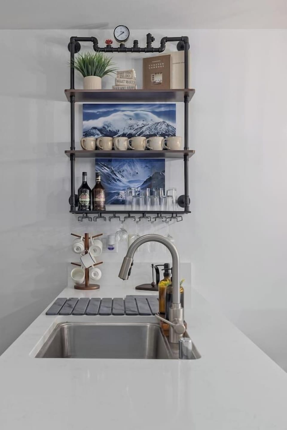 Quartz counters and a stocked glassware shelf, ready for apres-ski drinks.