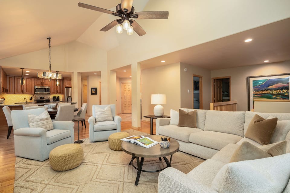Spacious open floor plan connects the living room, dining area, and kitchen