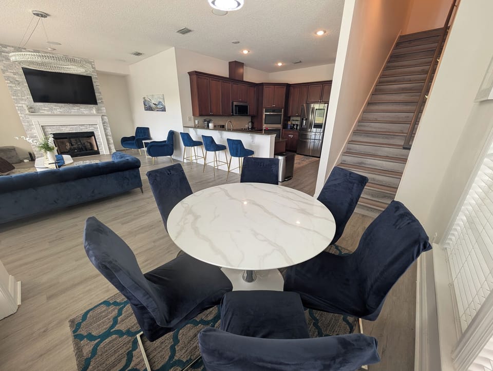 Casual dining area for six with an open view into the kitchen and living room.