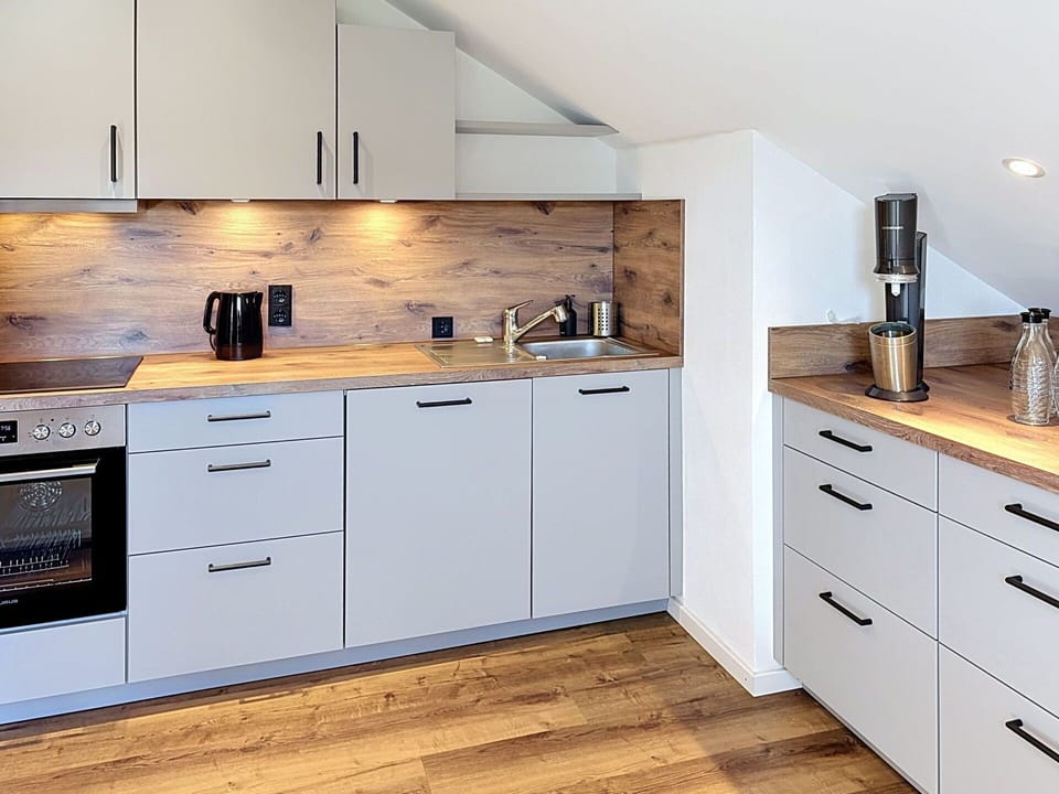 Kitchen, Countertop, Flooring, Wood, Cabinetry, Interior Design, Kitchen Appliance, Major Appliance, Furniture, Floor