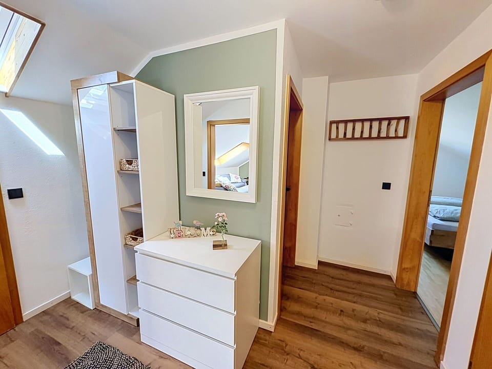 Furniture, Interior Design, Wall, Flooring, Wood, Floor, Cabinetry, Room, Home, Lighting