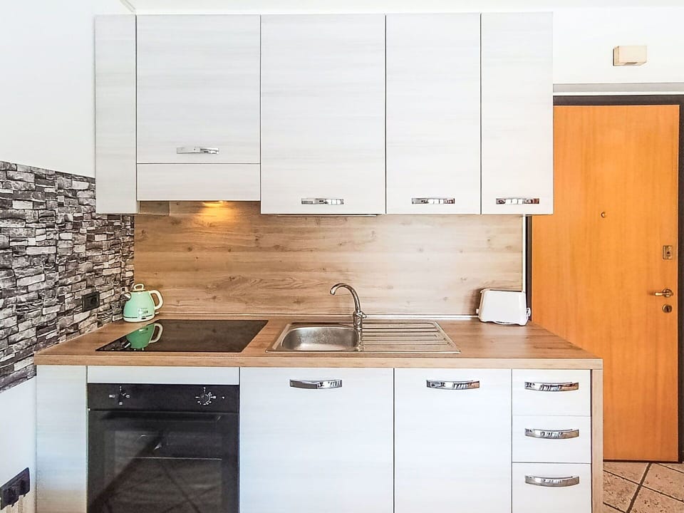 Kitchen, Kitchen Appliance, Countertop, Cabinetry, Interior Design, Flooring, Major Appliance, Wood, Furniture, Floor