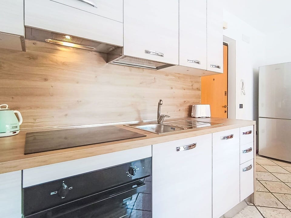 Countertop, Kitchen, Kitchen Appliance, Cabinetry, Flooring, Interior Design, Major Appliance, Furniture, Wood, Floor