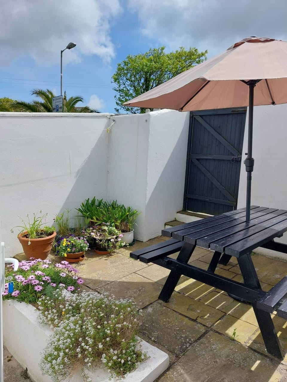 Channel View rear patio, enjoy a BBQ, picnic table and parasol
