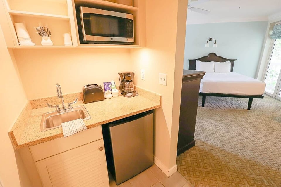 Deluxe Studio • Kitchenette Looking to Bed