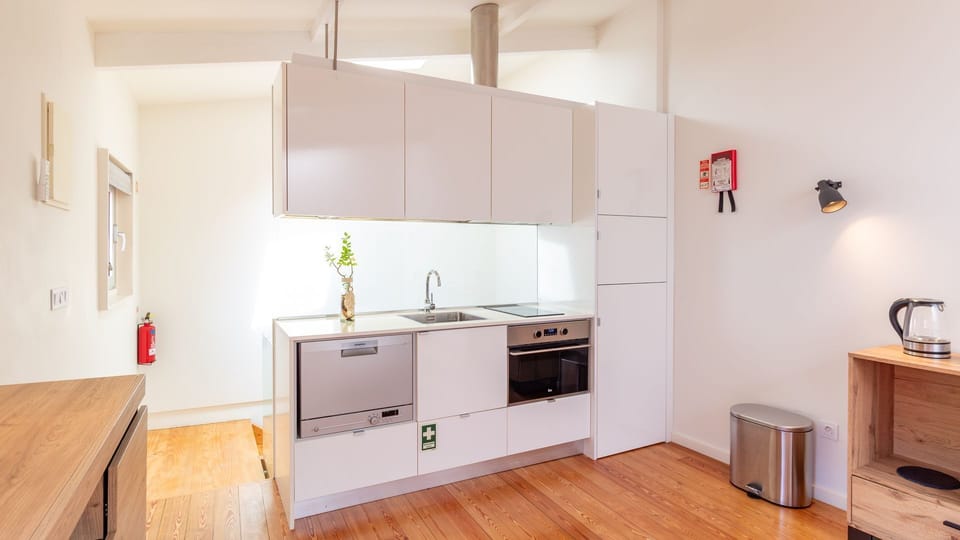 A sleek, fully equipped kitchenette with everything you need for a comfortable stay.
#CookAtHome #FullyEquipped #ModernKitchen