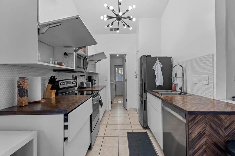 Kitchen with access to laundry room.
